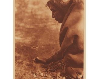 2007
After Edward Sherriff Curtis
1868-1952, Los Angeles, CA
"Kindling Fire - Assiniboin," Plate 631 From "The North American Indian"
Photogravure printed in sepia on light-tan paper under glass
From the edition of unknown size
With the engraved plate number in the blank above the image at the upper left; and the engraved title, copyright, and publisher lines in the blank below the image: From Copyright Photograph 1926 by E.S.Curtis, and Photogravure Suffolk Eng. Co. Cambridge, Mass
Image: 15.5" H x 11.5" W; Sight: 17" H x 12.5" W <br />
Estimate: $500 - $700