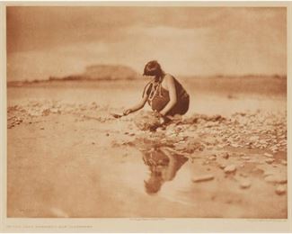 2008
After Edward Sheriff Curtis
1868-1952, American
"In The Gray Morning - San Ildefonso," Plate 591 From "The North American Indian"
Photogravure printed in sepia on cream, tissue-thin, Japanese paper under glass
From the edition of unknown size
With the engraved plate number in the blank above the image at the upper left; and the engraved title, copyright, and publisher lines in the blank below the image: From Copyright Photograph 1905 by E.S.Curtis, and Photogravure Suffolk Eng. Co. Cambridge, Mass
Image: 11.5" H x 15.25" W; Sight: 12.625" H x 16" W
Estimate: $500 - $700