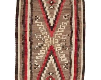 2009
A Navajo Regional Rug
Mid-20th Century; Diné
Woven in red, cream, black, grey and maroon wool with a storm pattern motif and elaborate serrated border
68" H x 47.75" W
Estimate: $800 - $1,200