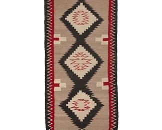 2014
A Navajo Regional Rug
Late 20th Century; Diné
Woven in cream, red, black and yellow wool with three conjoined concentric serrated diamonds to center and sawtooth border to sides
59" H x 27" W
Estimate: $300 - $500