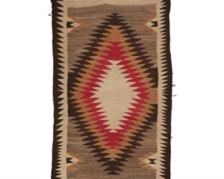 2022
A Navajo Regional Rug
Second-Quarter 20th Century; Diné
Woven in red, cream, ochre, light and dark brown wool in a serrated diamond motif with a serrated border
67.5" H x 39.5" W
Estimate: $300 - $500