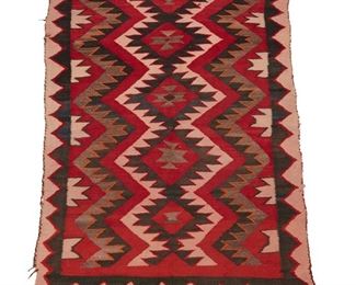 2027
A Navajo Regional Rug
First-Quarter 20th Century; Diné
Woven in red, cream, black, and orange wool with a central conjoined column of serrated diamonds and a zig zag border
50" H x 37" W
Estimate: $300 - $500