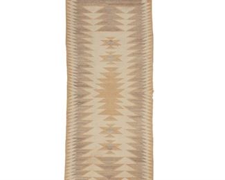 2029
A Navajo Regional Runner Rug
Second Half 20th Century; Diné
Woven in cream, pale tan, pale grey, and natural grey wool with a large central serrated diamond and stacked triangles and floating hourglass motifs at either end
72.25" H x 30.25" W
Estimate: $500 - $700
