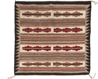 2030
Mary Arnold (B. 20th Century, Diné)
A Navajo regional rug
Woven in grey, black, cream, and red wool in geometric banding with a stepped border to sides
31" H x 30" W
Estimate: $200 - $400