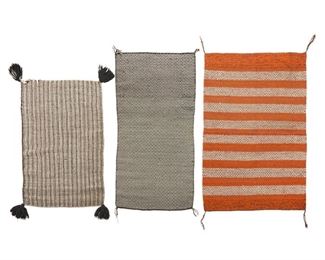2037
A Group Of Navajo Twill Saddle Blankets
Mid-20th Century; Diné
Three works including a double weave blanket woven in orange and brown wool (37.5" H x 57.5" W), a double weave blanket woven in black and white wool in a diamond pattern (28" H x 58" W), and a double weave striped blanket woven in black and white wool with large remnant tassels (29.5" H x 47" W), 3 pieces
Estimate: $700 - $900
