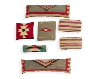 2045
A Large Group Of Southwest-Style Cushions
20th Century
Comprising three cushions with Chimayo weavings in wool, together with four cushions with Navajo / Diné wool weavings of various sizes, shapes, colors, and designs, including two long bolsters and two smaller cushions, with neutral backing fabric to all cushions, 7 pieces
Largest: 12.75" H x 41" L; Smallest: 9.5" H x 18" L
Estimate: $300 - $500