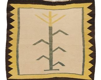 2055
A Navajo Yei Corn Motif Mat
Second Half 20th Century; Diné
Woven in yellow, green, brown, and cream wool with a central corn stalk motif and serrated border to sides
32.5" H x 34" W
Estimate: $200 - $300