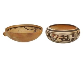 2072
Two Hopi Polychrome Pottery Vessels
Mid-20th Century
Each unsigned
Comprising a low bowl with polychrome geometric banding (3.25" H x 7.5" Dia.) and a low bowl with polychrome geometric figure to interior and lug to exterior for hanging (3" H x 8" Dia.), 2 pieces
Estimate: $200 - $300