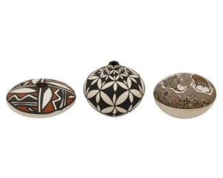 2076
Three Acoma Pueblo Miniature Pottery Vessels
Three works:

A Dorothy Torivio miniature pottery bottle
(1946-2011, Acoma Pueblo)
Signed to underside: Dorothy Torivio / Acoma / N.M.
The miniature black-on-white pottery bottle with all-over black "elastic" butterfly pattern on white slip glaze
2.25" H x 2.375" Dia.

A Rebecca Lucario miniature pottery seed pot
(b. 1951, Acoma Pueblo)
Signed to underside: Acoma / NM / R. Luciano
The miniature vessel with brown and polychrome fineline and shard details outlining two Mimbres-style scorpions on white slip glaze
1.5" H x 2.5" Dia.

A Paula Abeita miniature pottery seed pot
(20th Century, Acoma Pueblo)
Signed to underside: Acoma / "2011" NM / Paula Abeita
The miniature black and brown-on-white pottery pot with all-over pattern on white slip glaze
0.75" H x 2.75" Dia.

3 pieces
Estimate: $200 - $300