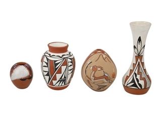 2077
A Group Of Puebloan Pottery Vessels
20th Century
Four works:

A Jemez Pueblo redware seed pot
Signed to underside: P.R. Tosa [possibly Percingula R. Tosa] / Jemes / N.M.
The redware pottery vessel with burnished red slip glaze and matte slip painted scene of a deer
5.5" H x 4.25" Dia.

A Jemex Pueblo redware seed pot
Signed to underside: [illegible] Toya / Jemez
The redware pottery vessel with burnished red slip glaze and matte slip painted feather and geometric motif
2.375" H x 3" Dia.

A Santa Clara Pueblo polychrome vase
Signed in black ink to underside: A. Tafoya
The bottleneck vase with polychrome feather motif
9.25" H x 3.5" Dia.

An Isleta Pueblo polychrome vase
Signed to underside: [illegible] / Isleta / N.M.
6" H x 4.25" Dia.

4 pieces
Estimate: $300 - $500