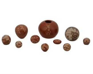 2084
A Group Of Santa Clara Pueblo Sgraffito Seed Pots
Second Half 20th Century
Ten works:

Two Gloria Goldenrod Garcia pots
Each signed to underside: Golden Rod; One further signed: Santa Clara
Comprising one with Koshare clown and one with hummingbird, 2 pieces

A Carla C. Nampeyo pot with Koshare clown, bread basket, and building
Signed and dated to underside: Carla C. Nampeyo / 84

A Grace Medicine Flower pot with rabbit motif
Signed to underside: Grace Medicine Flower / 85695

A Camilio Sunflower Tafoya pot with turkey and butterfly
Signed and dated to underside: Camilio Sunflower / Santa Clara Pueblo / 1986 / FIOWU

A Susan Pho-Sa-We Romero pot with bore in stormy landscape
Signed to underside: Pho-Sa-We [cipher] / J-14

A Gregory Lonewolf "Hummingbirds in Flight" pot
Signed to underside: NNRROG / Gregory Lonewolf / Santa Clara Pueblo

A Joseph Lonewolf pot with deer
Signed and dated to underside: Joseph Lonewolf [with cipher] / F20BRCW / 86

Two Debrah Harvey pots
Each signed: D