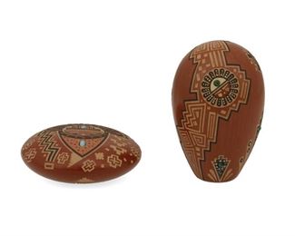 2085
Glendora Fragua (B. 1958, Jemez Pueblo)
Two Jemez Pueblo sgraffito seed pots
Each signed to underside with cornstalk
Each miniature sgraffito pottery vessel with burnished red slip glaze and shallow carved designs, comprising one flat pot with kachina face and inset turquoise (1" H x 2.625" Dia.) and an egg-form pot with sun faces and inset malachite (3" H x 1.875" Dia.), 2 pieces
Estimate: $150 - $250
