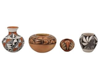 2088
A Group Of Southwest Pueblo Pottery
Second Half 20th Century and Later
Each signed to underside
A collection of Southwest pottery including a large polychrome Acoma vessel with lizards and geometric motifs by B.L. Cerno (6.25" H x 9.5" H), a small polychrome Acoma vase with two geometric bands by A. Corpuz (4.5" H x 4" W), a black and white Acoma vase with four repeated geometric sections (Signed: G.R; 3.5" H x 3.5" Dia.), a polychrome Hopi low bowl by Anita Polacca (3.25" H x 5.25" Dia.), and a miniature polychrome Jemez Pueblo bowl with scalloped rim by C Gachupin (2.25" H x 2.75" Dia.), 5 pieces
Estimate: $400 - $600