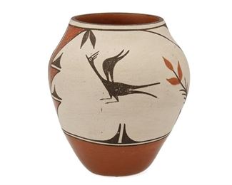 2093
A Zia Pottery Vessel
20th Century; Zia Pueblo, New Mexico
A tall polychrome pottery vase with bird and floral motifs
7" H x 6.5" Dia.
Estimate: $150 - $250