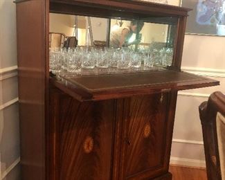 Marquetry Cocktail cabinet or dry bar with mirrored back; drop down front with tooled leather