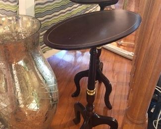 Pair of mahogany candle tilt top tables