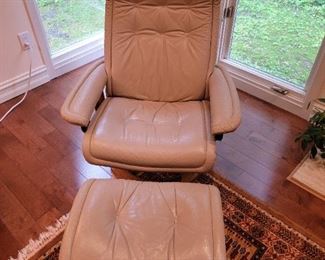 Very comfortable chair and ottoman made in Norway.  Chair goes back.