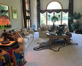 Zebra Rug, Drexel Heritage Down-Filled Sofas, Wood and Glass Coffee Table, Picasso Pillows, Sculptures