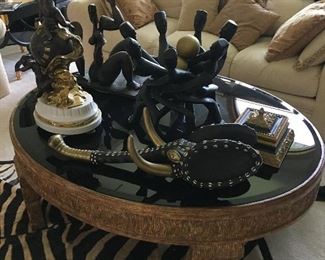 ROUND GOLD LEAF COFFEE TABLE W/BLACK GLASS TOP.