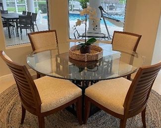 Tommy Bahama Ocean club glass top table with four chairs.