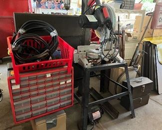 Compound miter saw on stand and hardware organizers