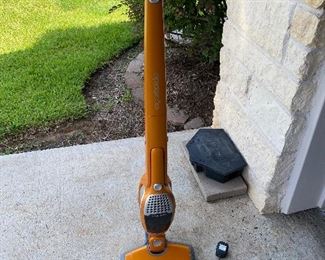 Floor vacuum that has a dust buster attached