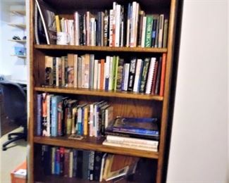 Large wood bookcase is for sale, as are all the books in the house