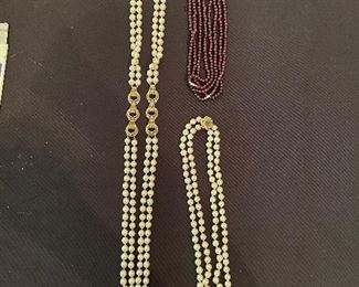 Gold and pearl necklace, pearl necklace with emerald and gold clasp, garnet necklaces 