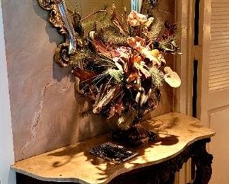 Carved wood console table with marble top