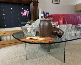 You can see the glass coffee table, additional glassware, one of those basket/serving trivets, and fireplace artwork.