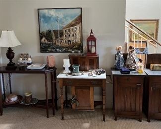 Several items are in this picture, including the baker's table in the middle. Dolls, art, cabinets, tables: all kinds of goodies.