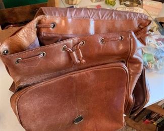 #99	Camel Leather Backpack w/drawstring (as is inside zipper/lining)	 $60.00 
