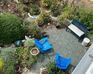 Outdoor garden area with furniture and decor