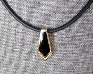 Diamonds 0.29 ctw and Black Onyx pendant at 5.92 carets on a rubber necklace with 14K gold caps and lobster clasp