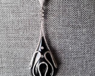 Onyx and Diamond Pendant/Enhancer tested 18K in white gold.  Tear drop cabochon onyx at 23.16 carets.  Total of 259 round diamonds at 1.13 ctw