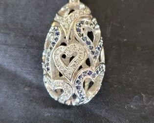 Sapphire and Diamond Pendant stamped and tested 14K white gold.  Open heart design with diamonds and sapphires.  Round diamonds 54 at 0.43 ctw.  Round faceted sapphires 67 at 0.67 carets.
