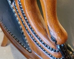 vintage black leather chair with gooseneck head arm design