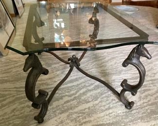 Wrought Iron horse motif coffee table with glass top.  Very heavy