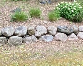 LARGE Boulder Wall. This large lot of boulders includes two rows and is about 34 feet long. These boulders are in varying degrees of size. 