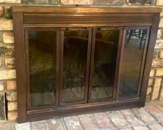 Fireplace Insert and Log Holder for Wood Burning Fireplace in good/used condition. Client will have the current ashes cleaned out before pick up. The winning bidder will need to bring the necessary tools to remove this item from the fireplace. The metal finish is a decorative brown tone and features sliding doors. Measures 37" x 28". 