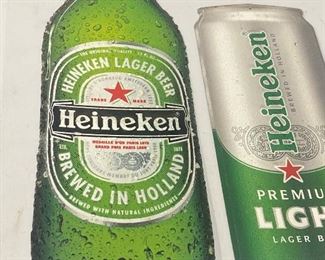 Two Heineken Beer Metal Signs - reproductions. Tallest sign measuring 23"