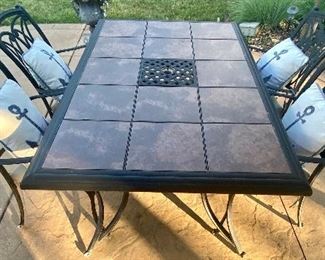 Nice Patio Table and Four Chairs in good condition with some wear consistent with outdoor use. Very nice design! 

Measures 65" x 44" 