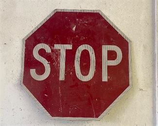 Metal Stop Sign in used condition with some wear including scratch/scrape marks and some paint loss. Measuring 30"