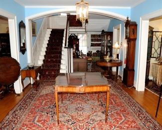 Beautiful front entrance with gorgeous oriental rug.