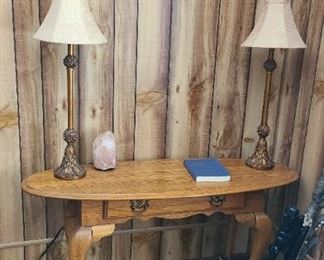 crossbow and table with lamps