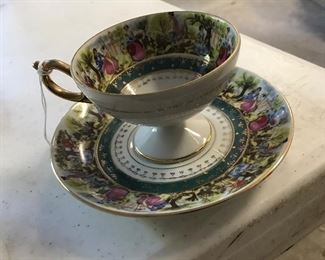 Set of 4 ornate decorated cups and saucers