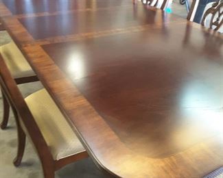 absolutely beautiful - by Universal Furn... has 2 leafs - overall total length w/leafs =110 in. includes 8 chairs