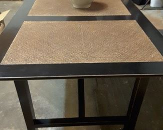 Great looking table!! Black finish with basket weave Rattan top