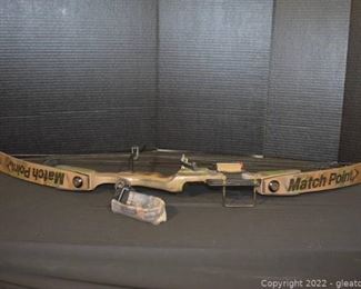 Camo Match Point Compound Bow with a Toughman Golden Key Futura Arrow Rest