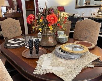 Different view of dining table showing beautiful silver and gold table runners, and chargers, champagne flutes